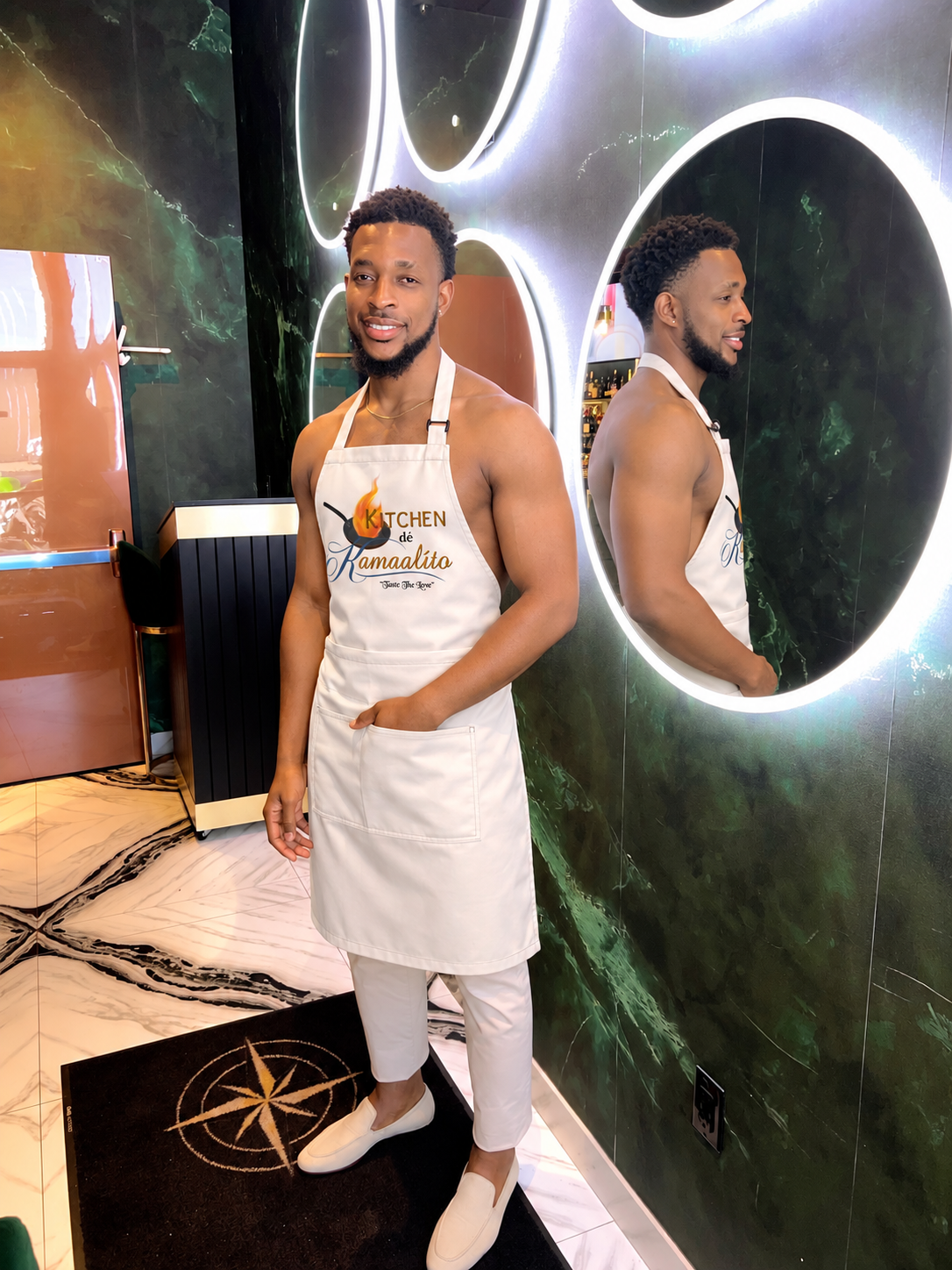 Kam wearing his Kitchen dé Kamaalíto chef apron